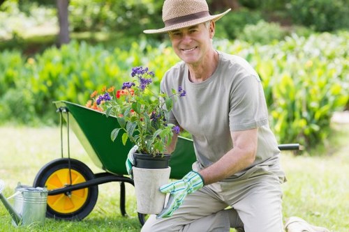 Workers managing garden waste and keeping the site tidy